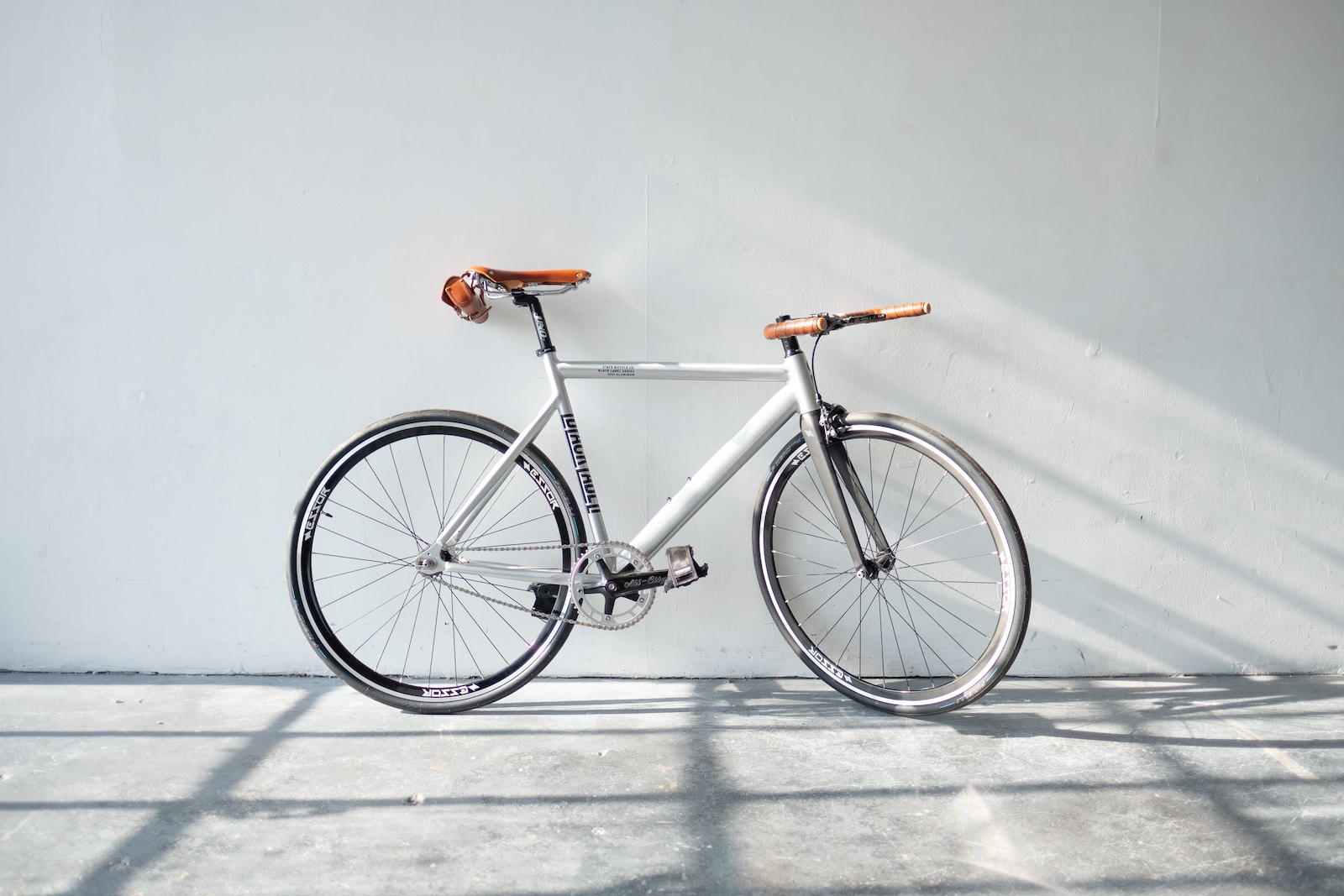 gray bike against a wall no driver's license needed